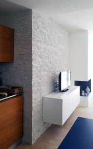 rivestimento soggiorno roma, pietra ricostruita roma, arredare con la pietra, finta pietra, rivestimenti interni
